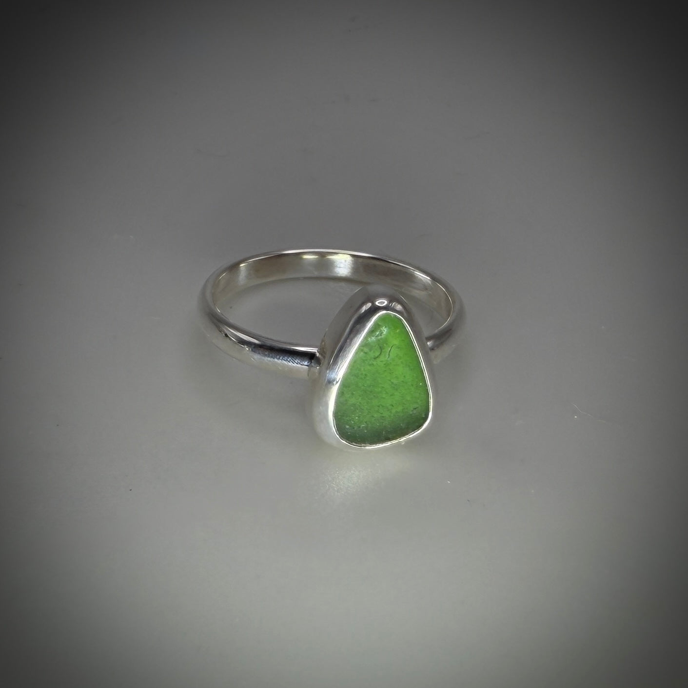 Natural Sea Glass (Monterey beach) set in Sterling Silver size  6 band