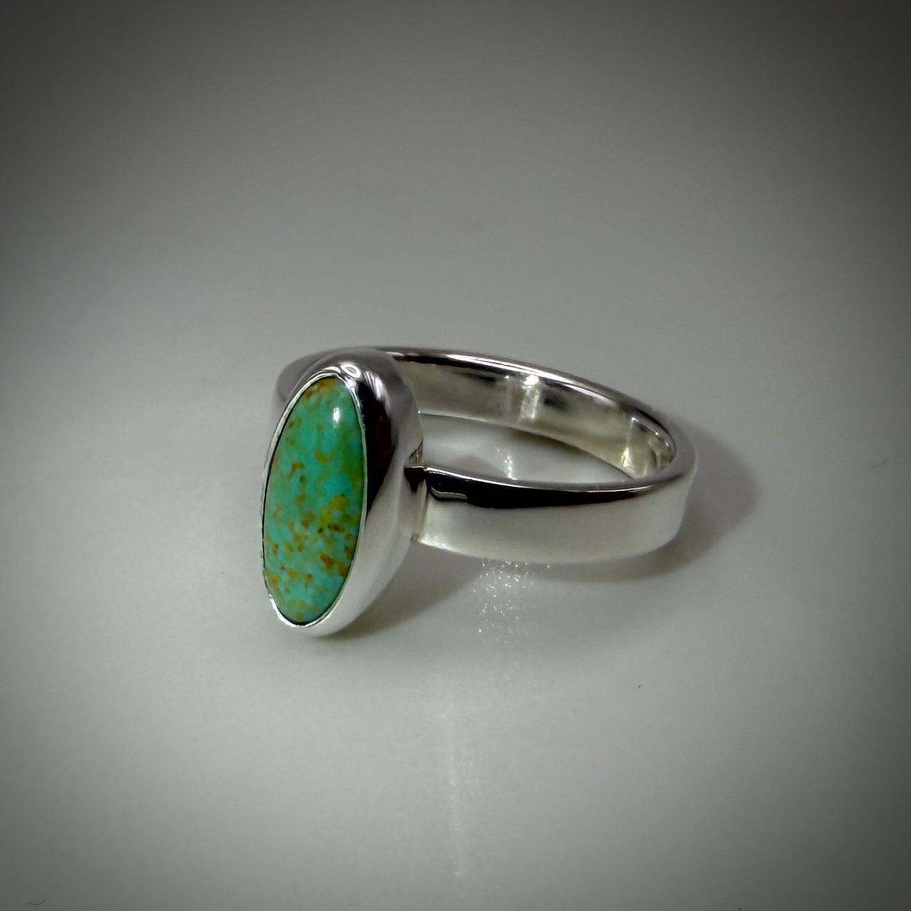 Kingman Turquoise set in Sterling Silver size 6 band